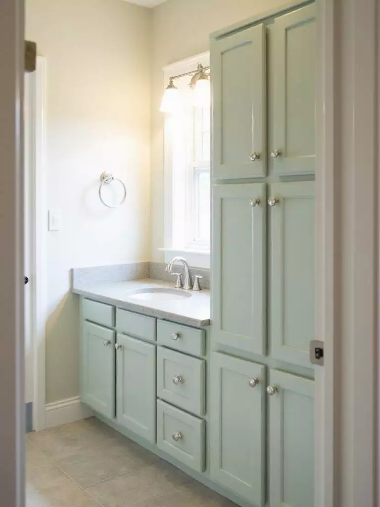 Bathroom vanity makeover with painted cabinets and new hardware.