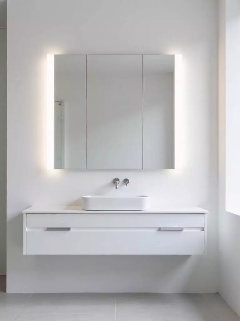 Modern bathroom vanity with daylight LED light bars providing bright, task-oriented lighting.