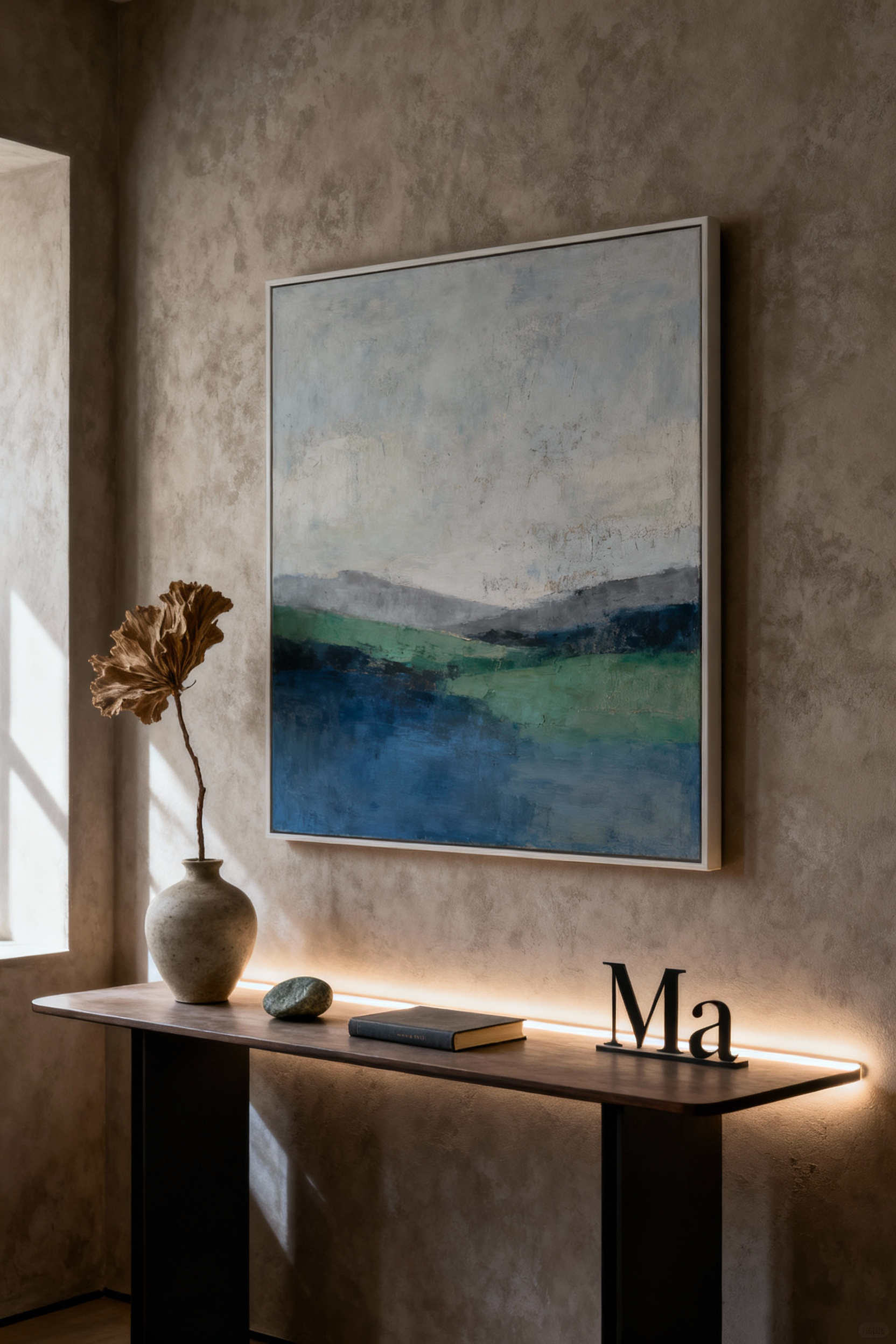 Bedroom vignette with abstract art print, ceramic vase, and console table, illuminated by soft LED lighting.